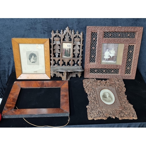 787 - A box containing 5 vintage frames with 3 fabulously intricate carved wooden examples. From the fabul... 