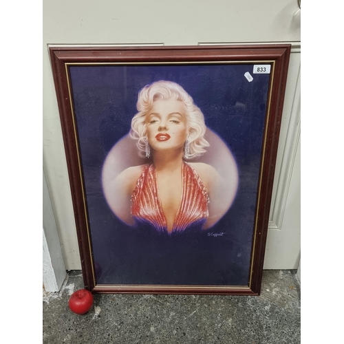 833 - A print showing the beautiful Marilyn Monroe in spotlight, by Stuart Coffield. Housed in a wood and ... 