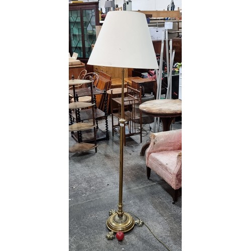 669 - Star Lot : A stunning antique solid brass floor standing lamp featuring fabulous claw feet.  From th... 