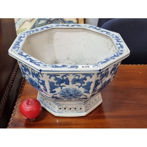 839 - A gorgeous large and heavy vintage ceramic octagonal planter decorated in a floral blue and white gl... 