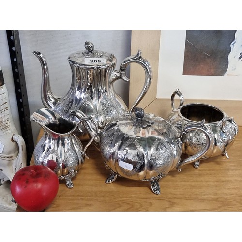 886 - An antique four piece silver plated coffee/tea service items including a coffee pot, teapot, creamer... 