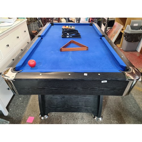 842 - A 6 x 3ft. feet Wooden pool table with black ash wood surround. With a full set of pool balls and 2 ... 