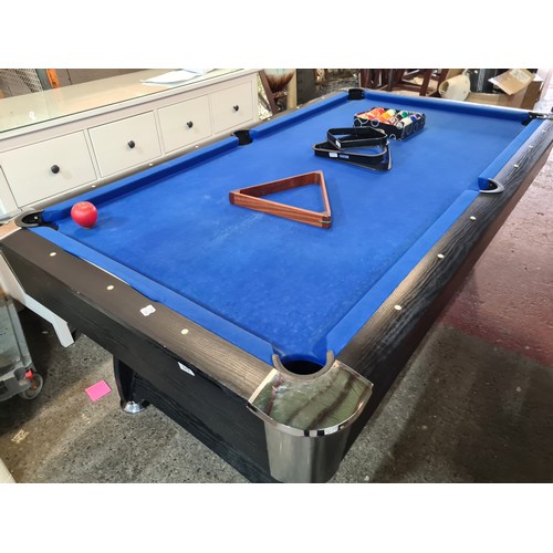 842 - A 6 x 3ft. feet Wooden pool table with black ash wood surround. With a full set of pool balls and 2 ... 