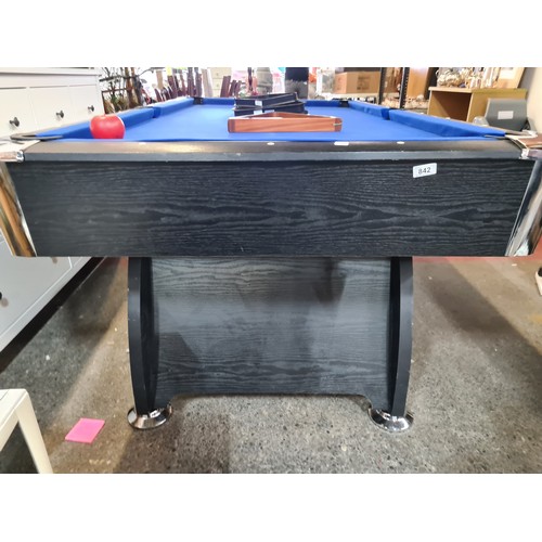 842 - A 6 x 3ft. feet Wooden pool table with black ash wood surround. With a full set of pool balls and 2 ... 