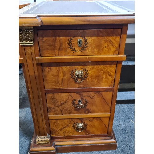 684 - Star Lot : A monumental large directors desk featuring a tooled leather top in three parts, with fou... 