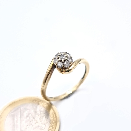 872 - Star lot : A 9K gold diamond cluster ring with a diamond of .3cts, jallmarked Birmingham, size N, we... 