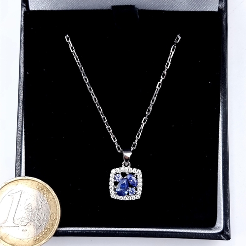 873 - A very pretty tazanite stone pendant set in sterling silver with white sapphire mount, length of cha... 