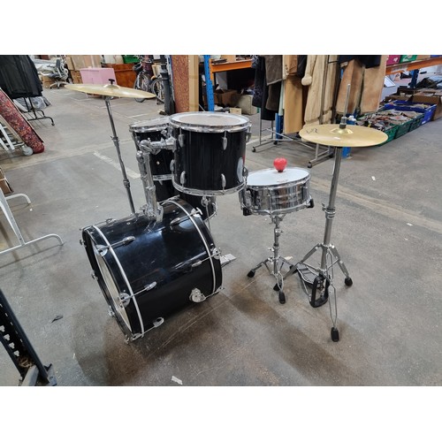 385 - Star Lot: A high quality drum set including five drums from Music Store Pro Drumline in varying size... 