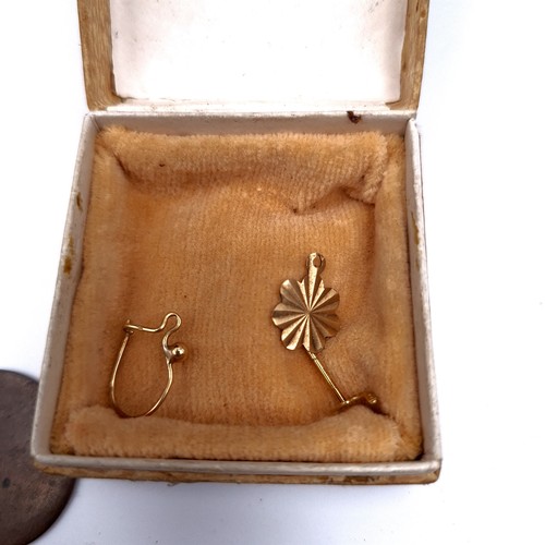 27 - An interesting assortment of items containing a small hallmarked gold pendant and other 9ct gold scr... 