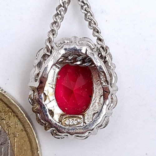 53 - A very pretty sterling silver large red gemstone pendant and chain, length 44cm.