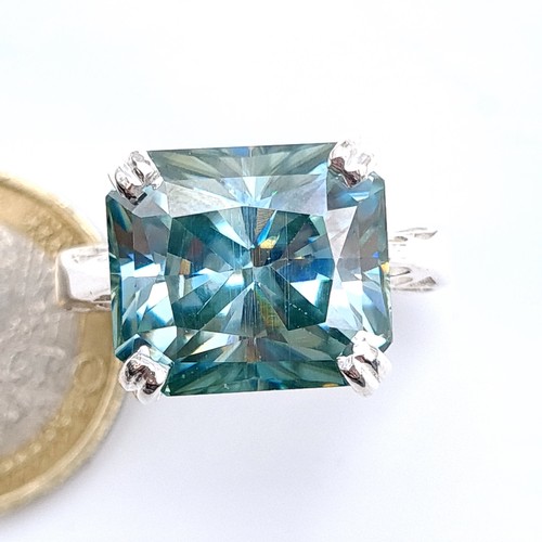 58 - A Fabulous huge blue aqua mossanite 22.9 cts ring set in sterling silver, ring size N, weight 6.3 gr... 