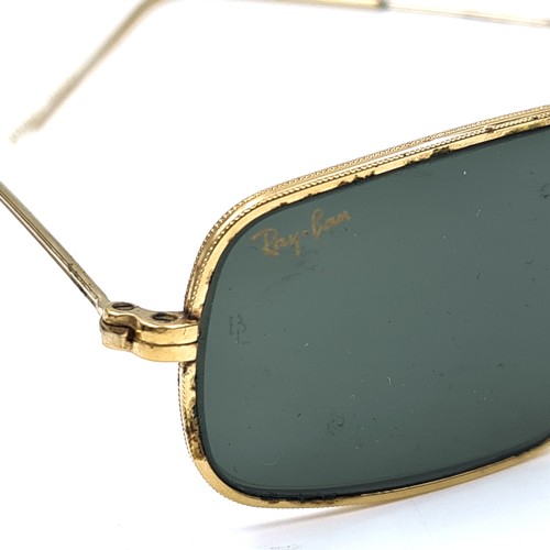 431 - A pair of original RayBan aviator style sunglasses set in gold metal frames, glasses come complete w... 