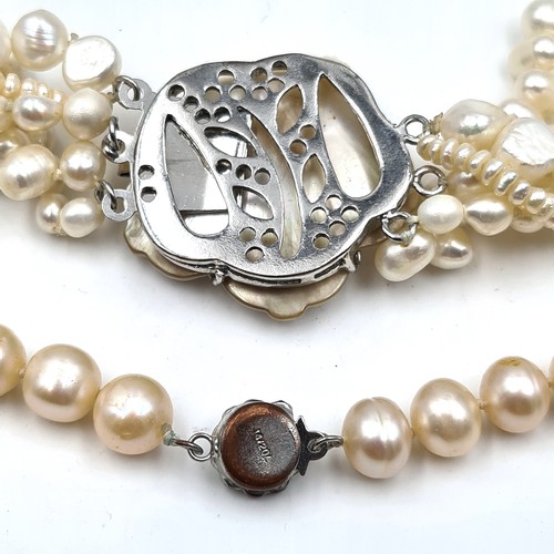 436 - Two natural pearl necklaces, the first a single strand example set with marcasite clasp together wit... 