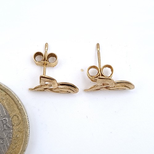 438 - A pair of Celtic design 9t gold stud earrings.