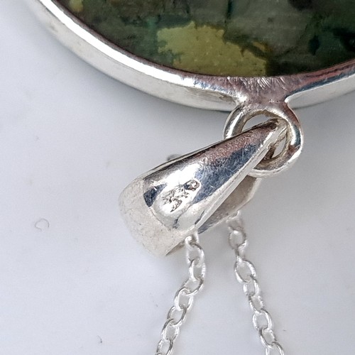 448 - A large polished agate sterling silver pendant with chain, length of chain 44cm, total weight 31 gra... 