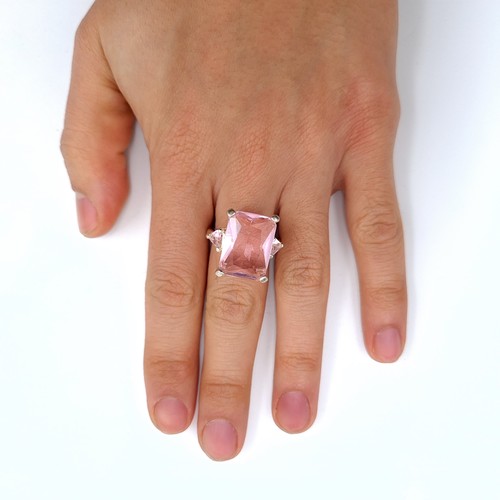 451 - A sterling silver huge pink gemstone ring, ring size P, weight 9.58 grams, boxed.