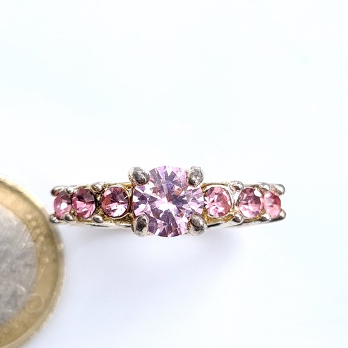 453 - A sterling Silver multi stone pink ring, ring size O, weight 6.86 grams.