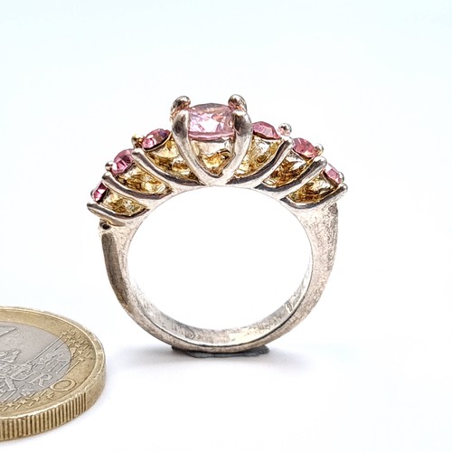 453 - A sterling Silver multi stone pink ring, ring size O, weight 6.86 grams.