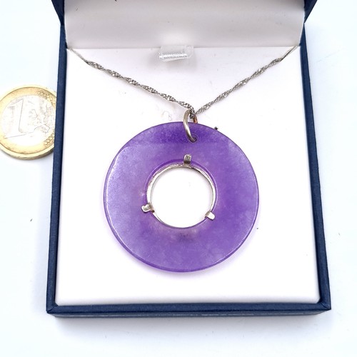 457 - A purple jade marcasite set pendant with silver chain, length of chain 40cm, total weight 10.5 grams... 