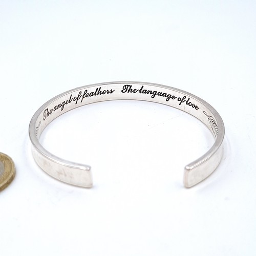 458 - A high grade silver bracelet with leaf design to inner band set with a love inscription. Weight 23.6... 