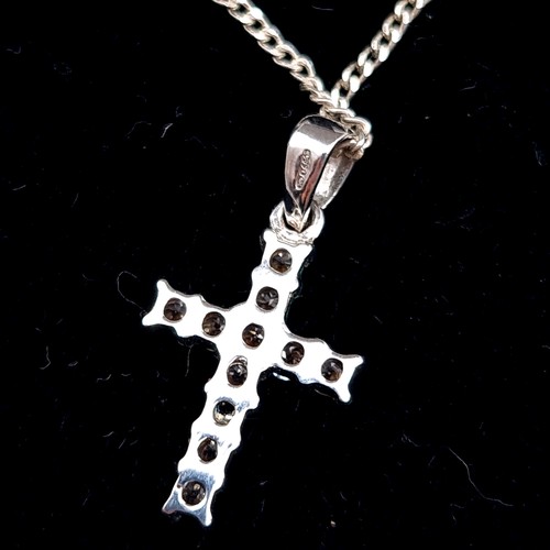 460 - A sterling silver cross pendant set with gem stone inlay, boxed.