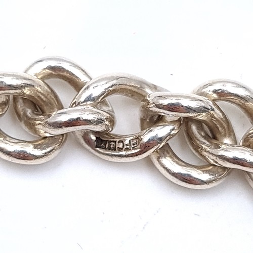 471 - A sterling silver twist link bracelet with padlock clasp and safety chain, weight 22.48 grams, boxed... 