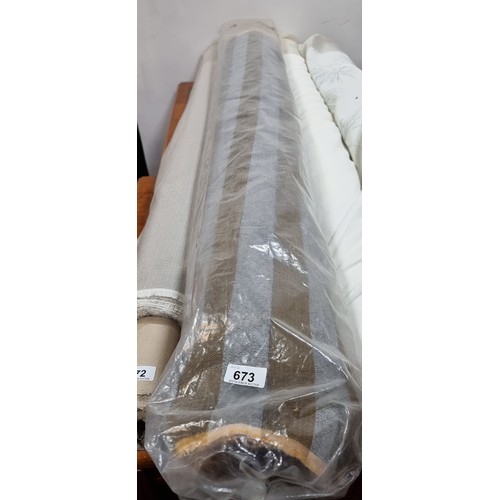 673 - A very large roll of high quality fabric in beige and grey with a tactile finish. Could do a couple ... 