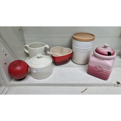 729 - Five pieces of Le Creuset ceramics including a condiment dish, jug and biscuit barrel. In very good ... 