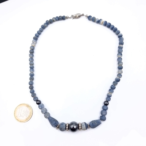 875 - A fine vintage Hematite graduated stone necklace with silver accents, set with a pearl mounted clasp... 