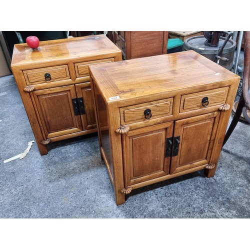 654 - Star Lot : A Fabulous pair of Chinese Fruitwood bedside lockers featuring two drawers and cabinet sp... 