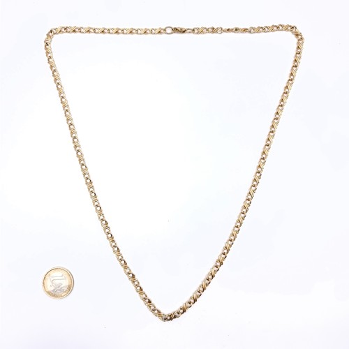 455 - A twist link gold toned necklace, length 64cm, weight 27 grams.