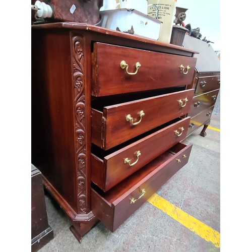 573 - An elegant dresser with four full-length drawers featuring brass swan neck handles. SD to drawer.