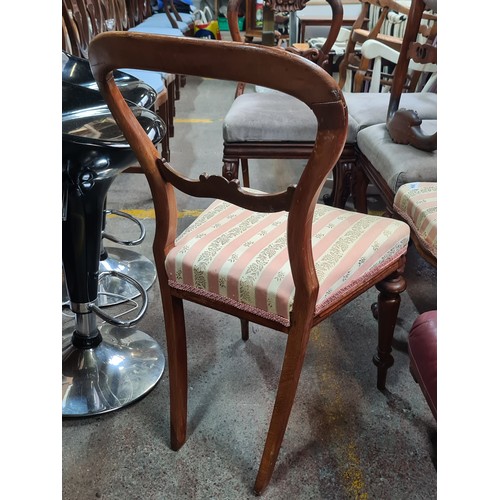 584 - A pair of Victorian oak kidney shaped back dining chairs.