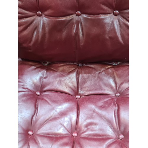 585 - Star Lot : A beautiful vintage Danish armchair by Daneware, after De Sede. Upholstered in deep red l... 