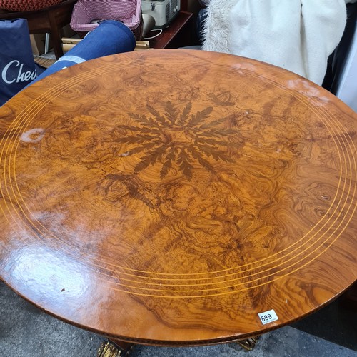 689 - Star Lot : A stunning and large Satinwood  round table with string inlay, marquetry and parquetry to... 