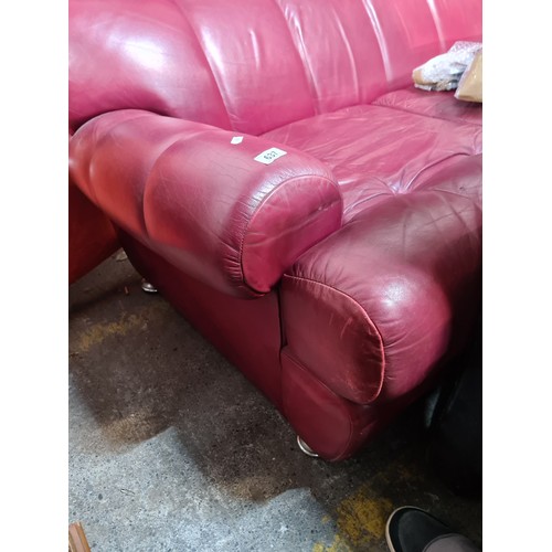 637 - Star Lot : A super mid century 1970s stylish red leather two seater sofa sat on chrome feet. It's a ... 