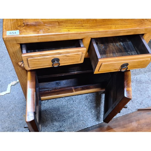 654 - Star Lot : A Fabulous pair of Chinese Fruitwood bedside lockers featuring two drawers and cabinet sp... 