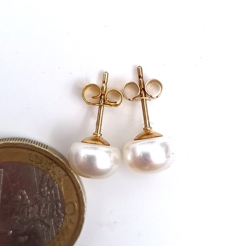 479 - A pair of 9K gold pearl stud earrings, Total weight 1.68 grams, boxed.