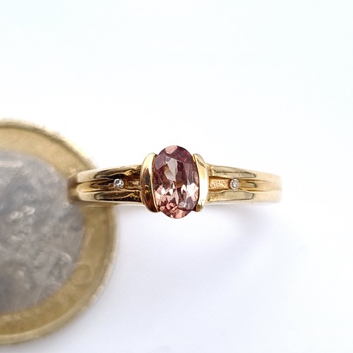 484 - A nice example of a 9K gold (375)  tourmaline stone ring with diamond accents, ring size o, weight 2... 