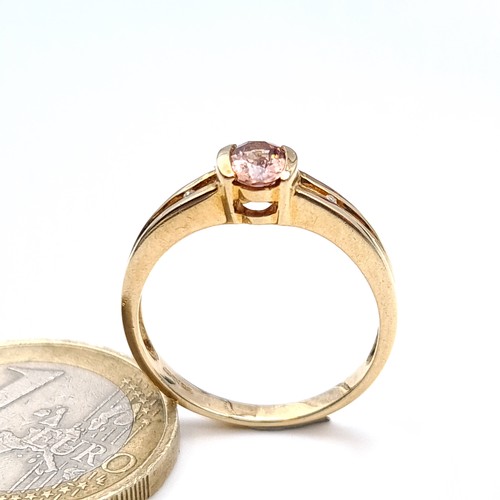 484 - A nice example of a 9K gold (375)  tourmaline stone ring with diamond accents, ring size o, weight 2... 