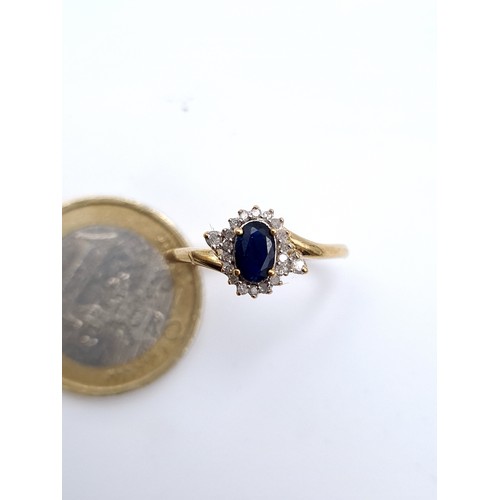 865 - Star Lot : A vintage very pretty 9k gold diamond and sapphire ring hallmarked Birmingham, diamond st... 