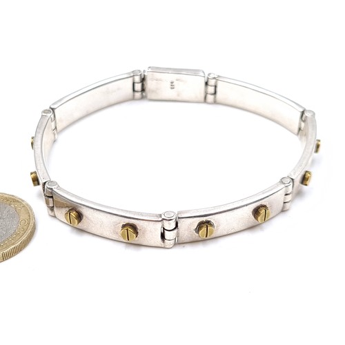 871 - A vintage art deco sterling silver bracelet with gold screw accents, weight 38.5 grams, boxed.