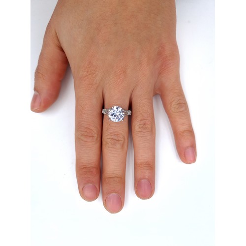 874 - A super gem stone solitaire ring with gem set mount set in sterling silver, ring size O, weight 3.44... 