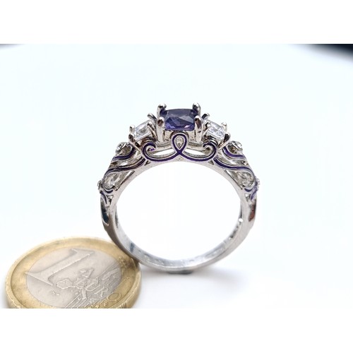 876 - An outstanding amethyst and gemstone ring with hallmarks for silver, size S, weight 4.45 grams, boxe... 