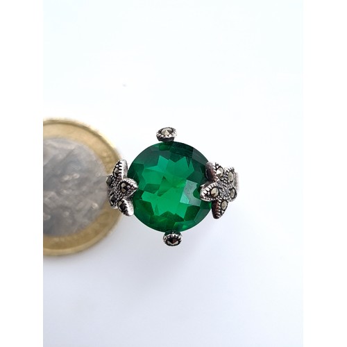 881 - a green tourmaline sterling stone ring with gem set marcasite mount, ring size S, weight 5 grams, bo... 