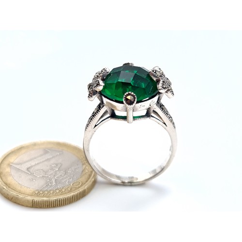 881 - a green tourmaline sterling stone ring with gem set marcasite mount, ring size S, weight 5 grams, bo... 