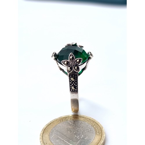 881 - a green tourmaline sterling stone ring with gem set marcasite mount, ring size S, weight 5 grams, bo... 