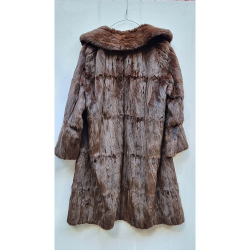 349 - Star Lot : A very stylish vintage genuine mink fur coat from Southern Furs Dublin. With pockets, hoo... 