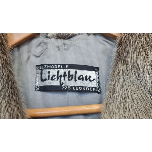 350 - Star Lot  : An unusual and stylish vintage fur coat in a black and white shade from Lichtblau. Appro... 