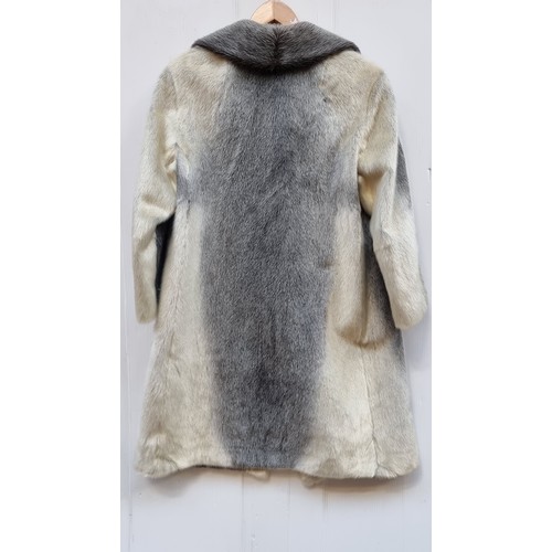 350 - Star Lot  : An unusual and stylish vintage fur coat in a black and white shade from Lichtblau. Appro... 